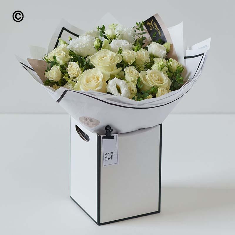 White fresh flowers, whiyer roses for a birthday or anniversary. 