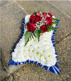 Red roses on pillow